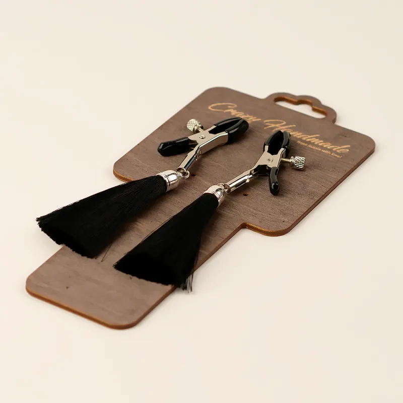 Зажимы на соски с шелковыми кисточками,цвет черный.